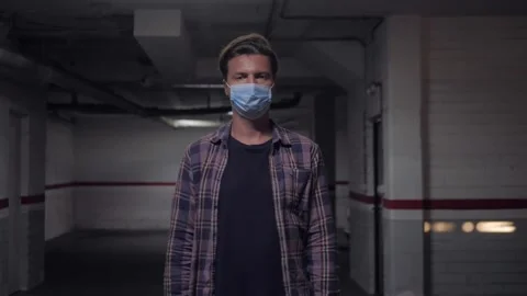 Man auto mechanic wearing protective face mask while standing with arms crossed Stock Footage 143647892