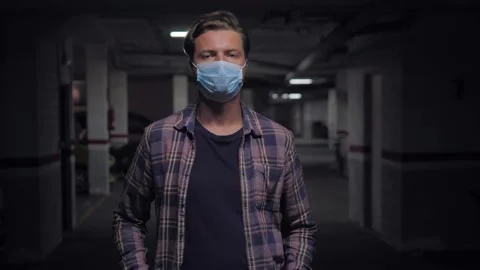 Man auto mechanic wearing protective face mask while standing with arms crossed Video stock 144380037