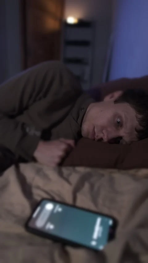Man avoiding phone call, social exhaustion, digital fatigue, emotional shutdown Video stock 321089753
