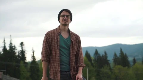 Man with an ax on the forest background Stock Footage 76247164