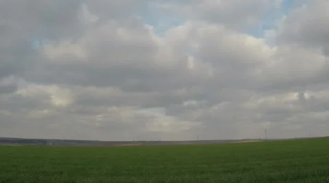 A man with an axe is running on field Stock Footage 62072858