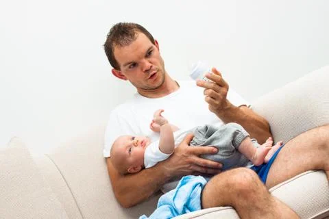 Man babysitting Stock Photos