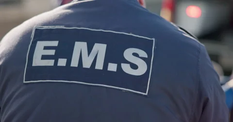 Man, back and ems paramedic in emergency, ambulance and working in healthcare 스톡 동영상 252734673