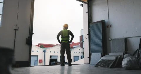 Man, back and engineer at building with thinking, project management or vision Stock Photos