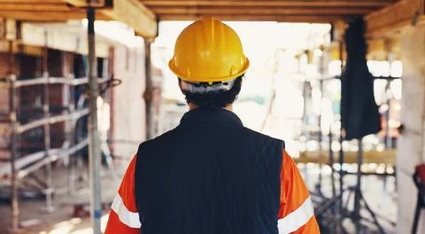 Man, back and walking for construction site, inspection and contractor comp.. Stock Photos
