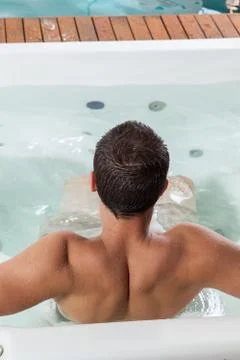 Man back inside a jacuzzi Stock Photos
