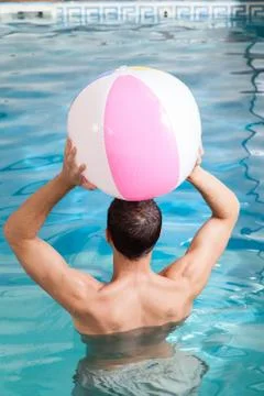 Man back playing with a inflatable ball Foto stock