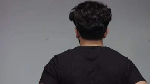 Man from the back then turning to look at camera Stock Footage 85693285