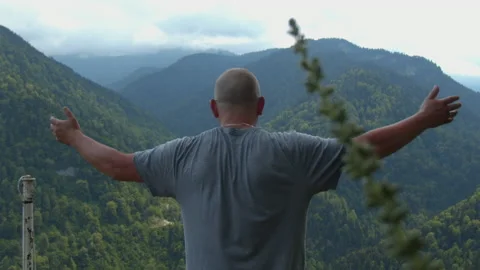 Man on the background of the mountain in slow motion Stock Footage 131933842