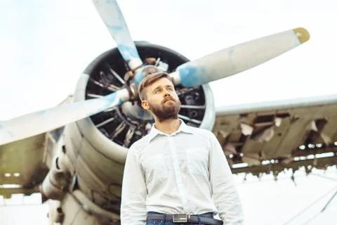 A man on the background of an old plane Stock Photos