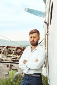 A man on the background of an old plane Stock Photos