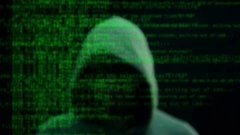 Man in background with scrolling hacker text in foreground Stock Footage 72440241