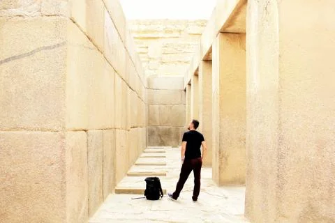 Man with backpack in ancient place Stock Photos