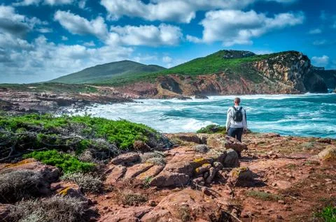 Man, backpack, coast, excursion, alghero, sardinia Foto stock