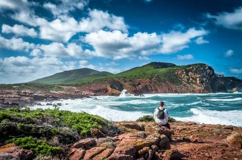 Man, backpack, coast, excursion, alghero, sardinia Stock Photos