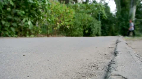 Man with a backpack goes on a sidewalk  库存影片 67315927