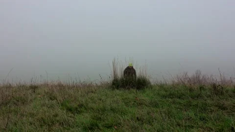 Man with backpack hiking in the fog Stock Footage 224060354