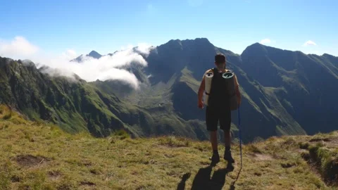 Man With Backpack Hiking On Mountain Landscape Stock Footage 150965876