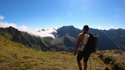 Man With Backpack Hiking On Mountain Landscape Stock Footage 156904741