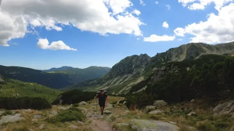 Man With Backpack Hiking On Mountain Landscape Stock Footage 156908925
