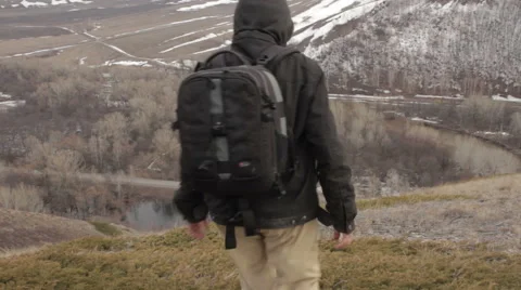 A man with a backpack on a mountain Stock Footage 62112191