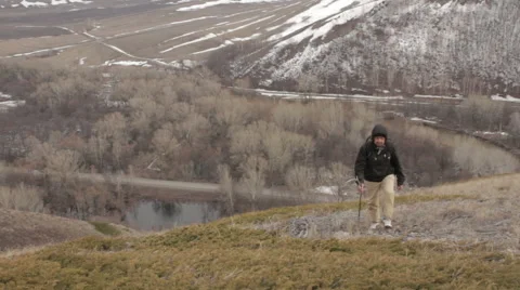 A man with a backpack on a mountain Stock Footage 62116251