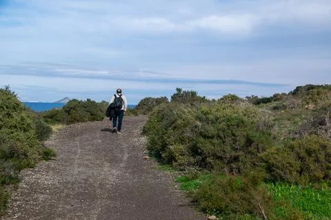 Man with backpack on a path Stock Photos