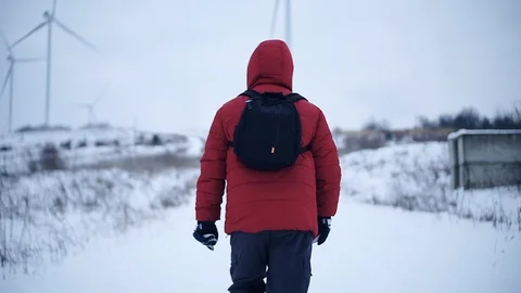 Man with backpack run along in winter mountains snow lifestyle equipment Stock Footage 105204695