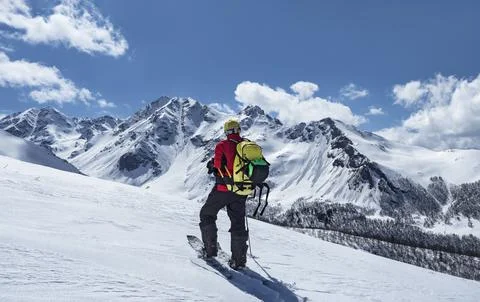 Man with backpack ski touring 스톡 사진