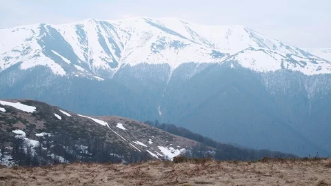 Man with backpack in spring mountains Stock Footage 107333485