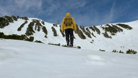 Man with a backpack travels in the mountains Stock Footage 154340802