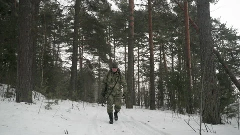 A man with a backpack travels through the forest in winter. North Karelia. Видео 169097842