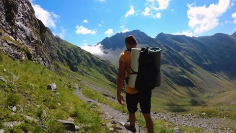 Man With Backpack Trekking On Mountain Landscape Stock Footage 156904760