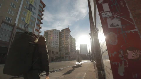 Man with Backpack Walking Downtown Video stock 33846946
