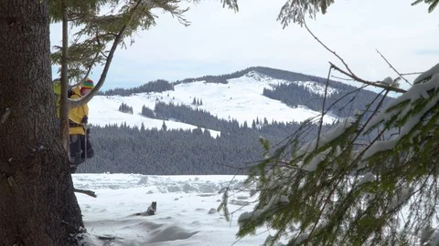 A man with a backpack walks in the winter forest Stock Footage 127334906