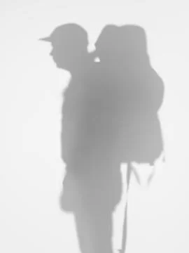 Man with backpacker, silhouette Illustrazione stock