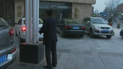 Man backs out car 1 Stock Footage 39829428