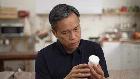 Man with bad memory looking at container Stock Footage 224085650