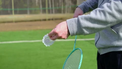 Man with a badminton racket. Stock Footage 153582059