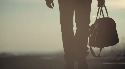 A man with a bag on the road Stockbeeldmateriaal 46933990