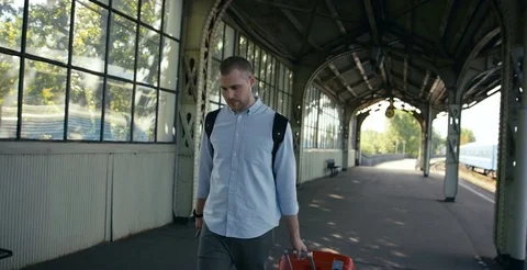 Man With Bag At Train Station Stock-Footage 78772125
