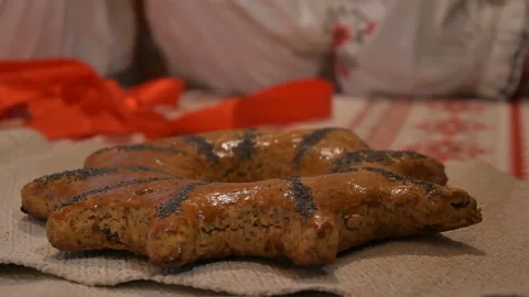 Man baker puts gingerbread on the table Stock Footage 145376413