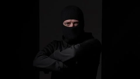 Man in Balaclava with Serious Expression Stock Footage 297307662