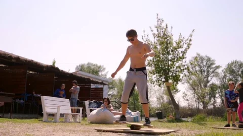 A man balancing on a board Stock Footage 107537625