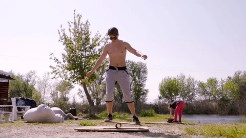 A man balancing on a board Stock Footage 107537686