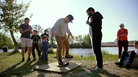 A man balancing on a board Stock Footage 107555416