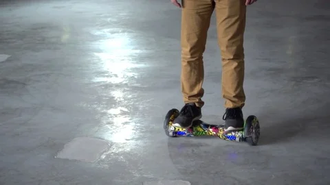 Man Balancing Segway Hoverboard Motorized Scooter Io Hawk - Close-Up Stock Footage 74949823