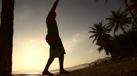 Man balancing on slackline at beach Stock Footage 68407918
