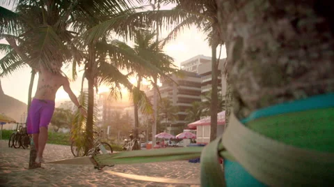 Man balancing on slackline on Ipanema beach Stock Footage 59377812