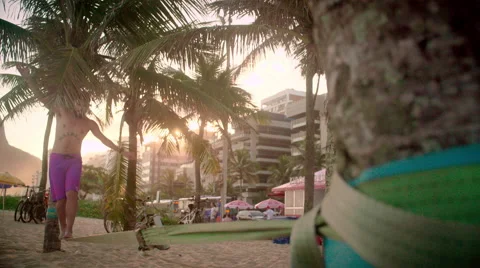 Man balancing on slackline on Ipanema beach Stock Footage 59377829